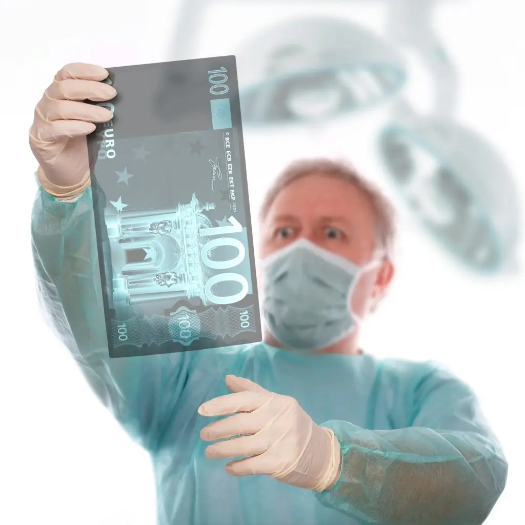 Doctor checking an 100 euro x-ray